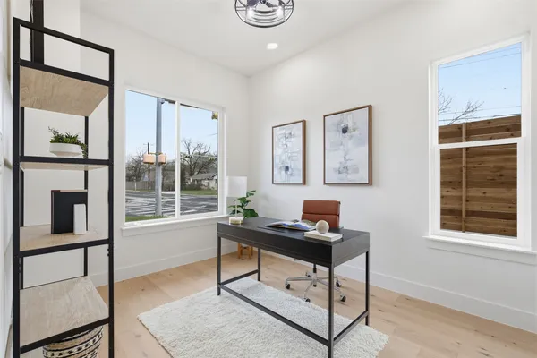 a work room with furniture and windows
