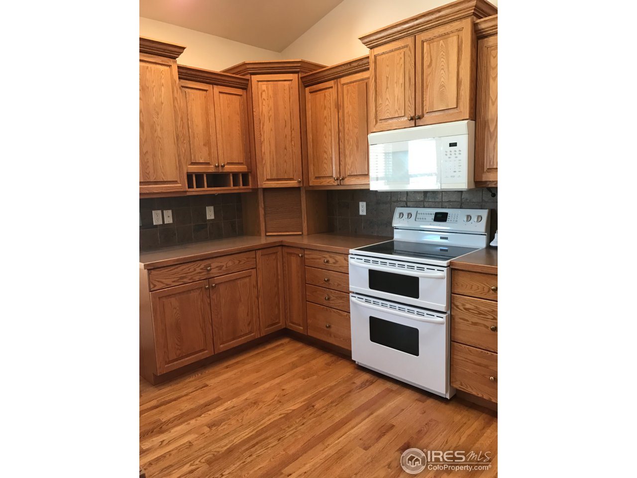 165 Ridge Road Eaton, CO 80615 - Photo 13 of 40 Recessed light under cabinets & above