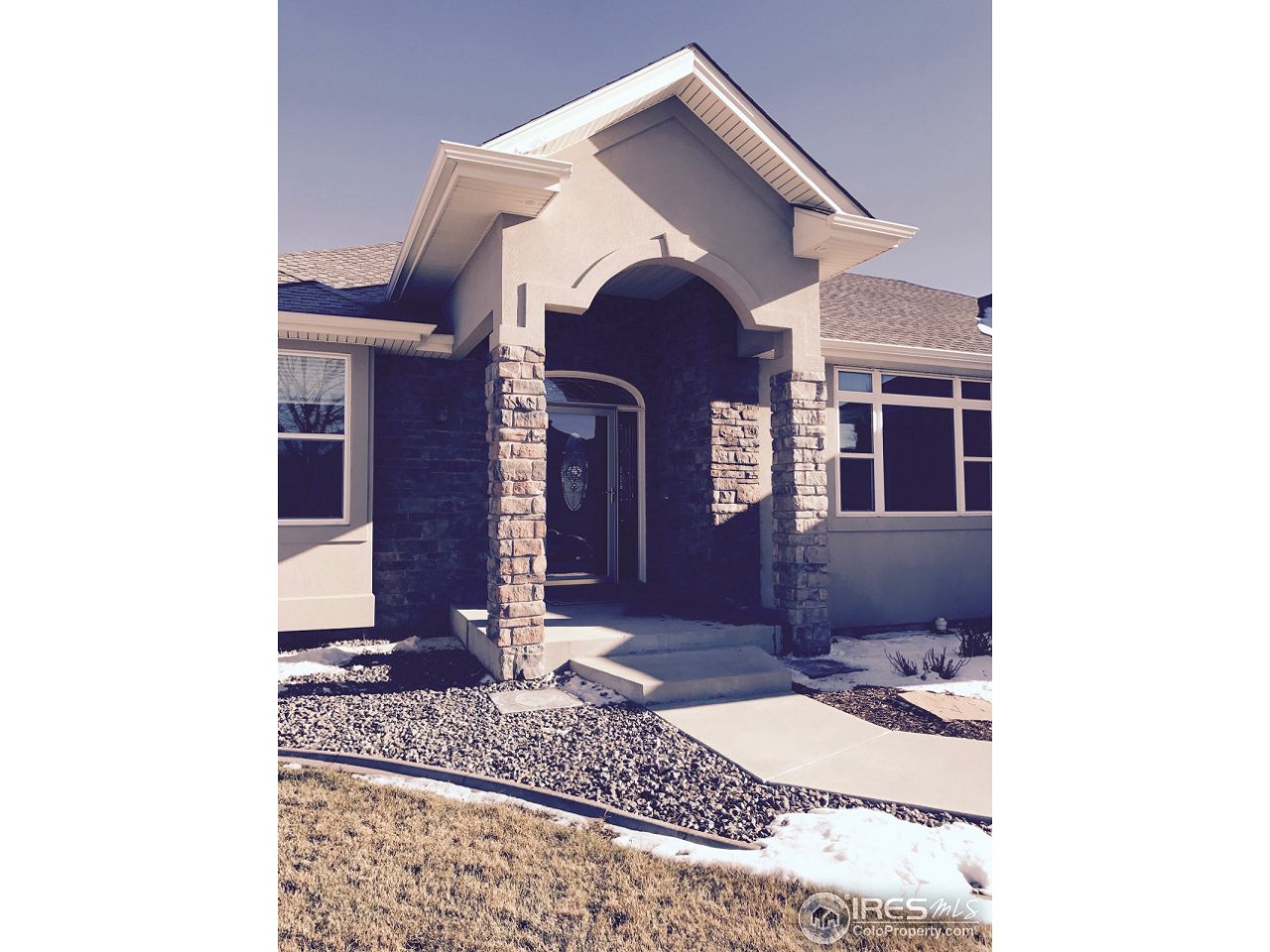 165 Ridge Road Eaton, CO 80615 - Photo 2 of 40 Stone covered porch is kind to guests