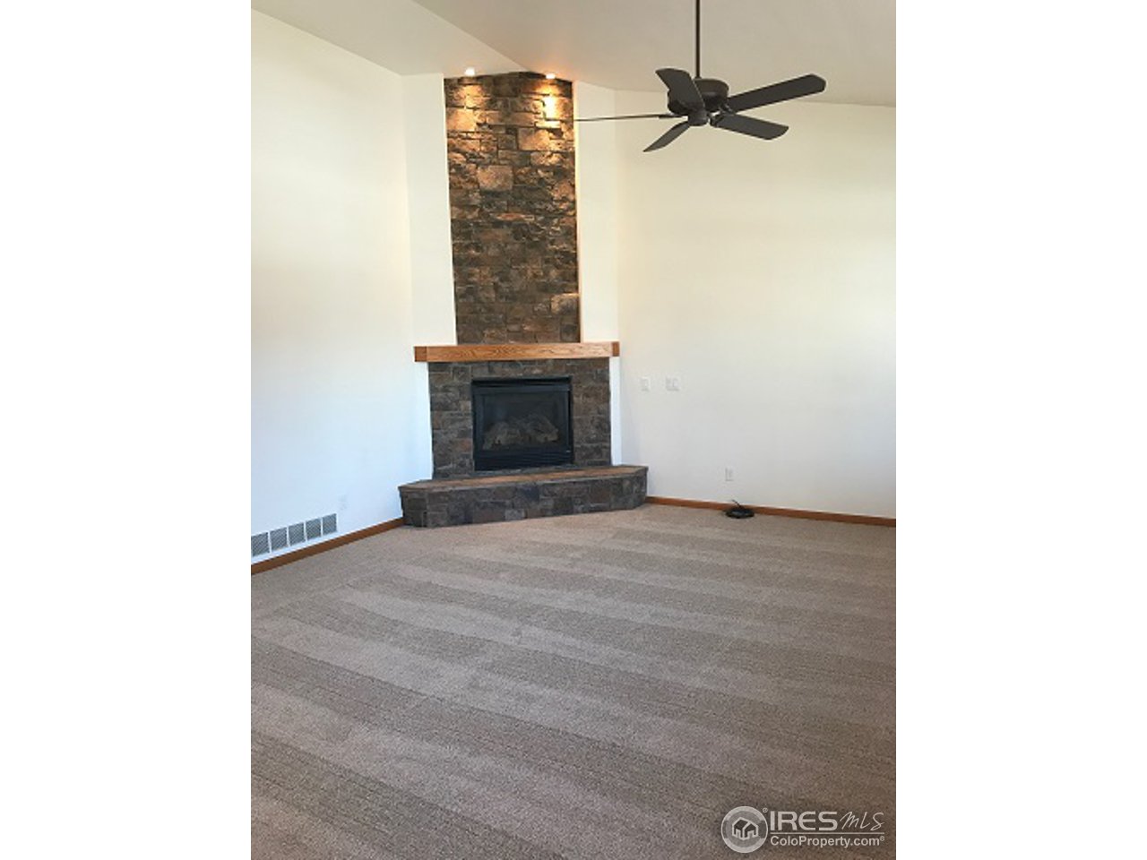 165 Ridge Road Eaton, CO 80615 - Photo 5 of 40 Two story stone gas fireplace