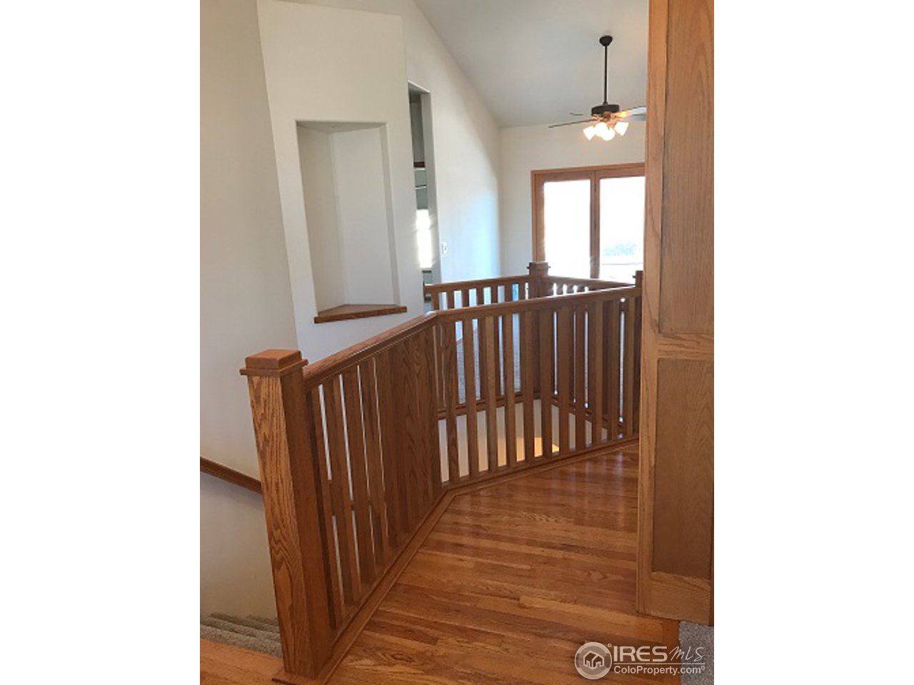 165 Ridge Road Eaton, CO 80615 - Photo 7 of 40 Custom wood railings & many spotlighted art niches