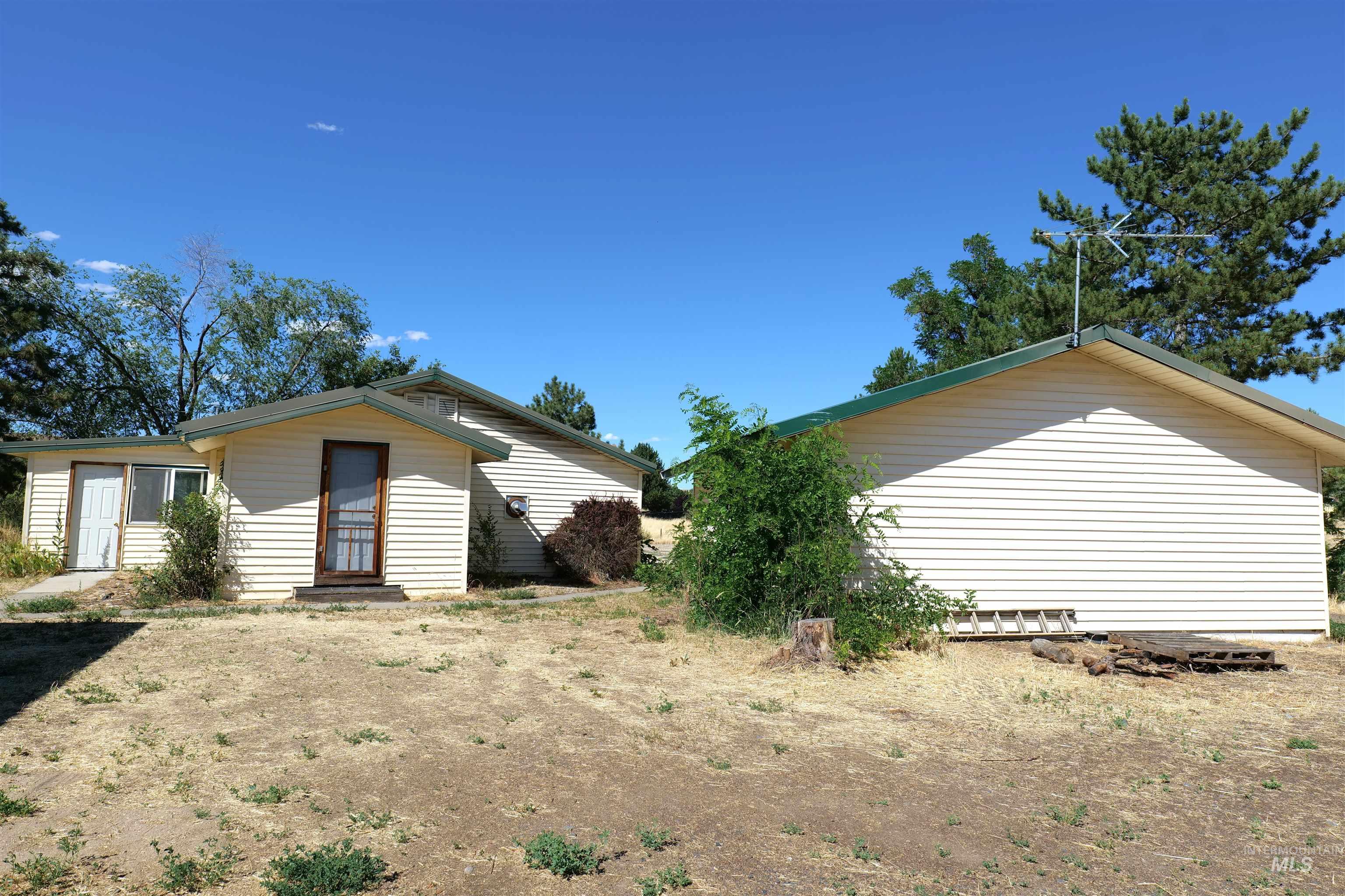 1485 East 9th Street Weiser, ID 83672 - Photo 18 of 18 Property featuring light-colored horizontal siding and a green-trimmed roofline