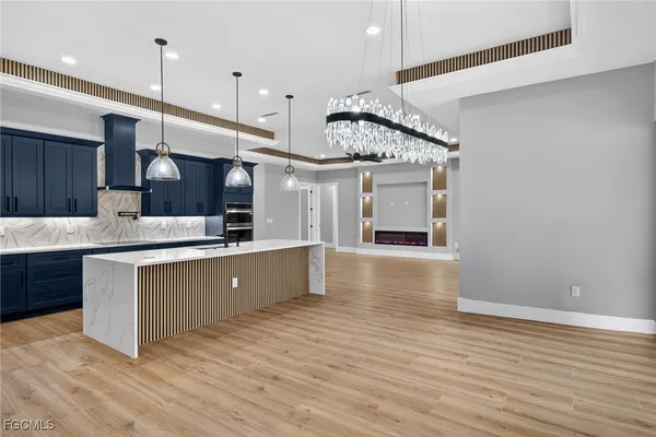 a large kitchen with stainless steel appliances kitchen island a large island in the center