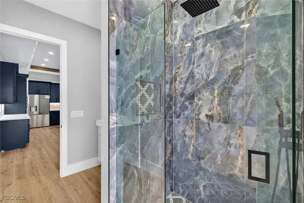 a view of a bathroom from a hallway