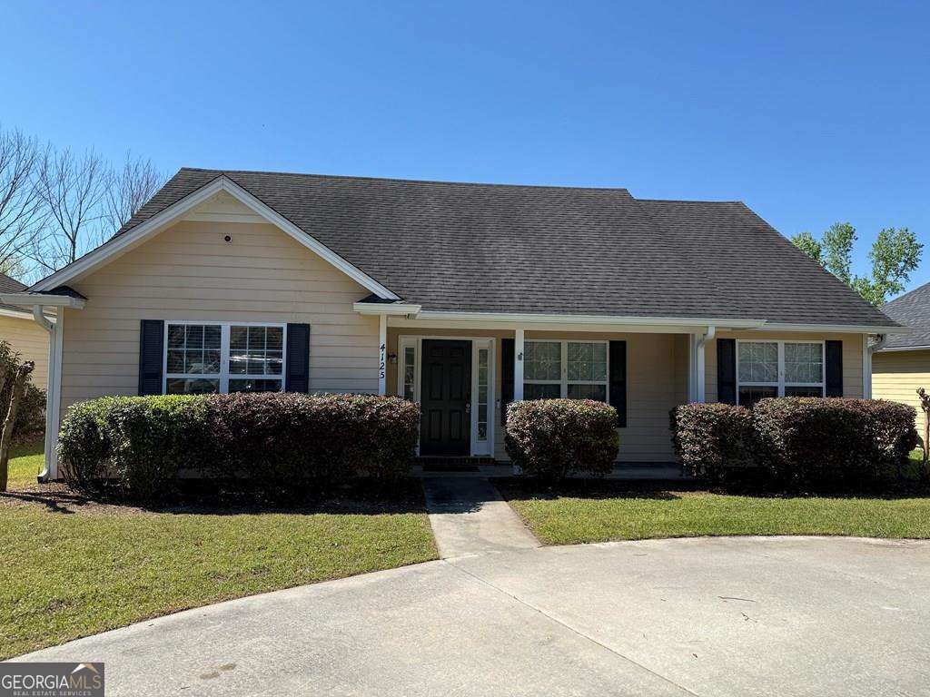 4125 Springruff Drive Valdosta, GA 31602 - Photo 1 of 22 a front view of a house with a garden