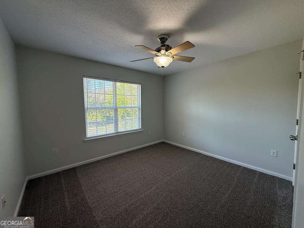 4125 Springruff Drive Valdosta, GA 31602 - Photo 16 of 22 an empty room with a window and a fan