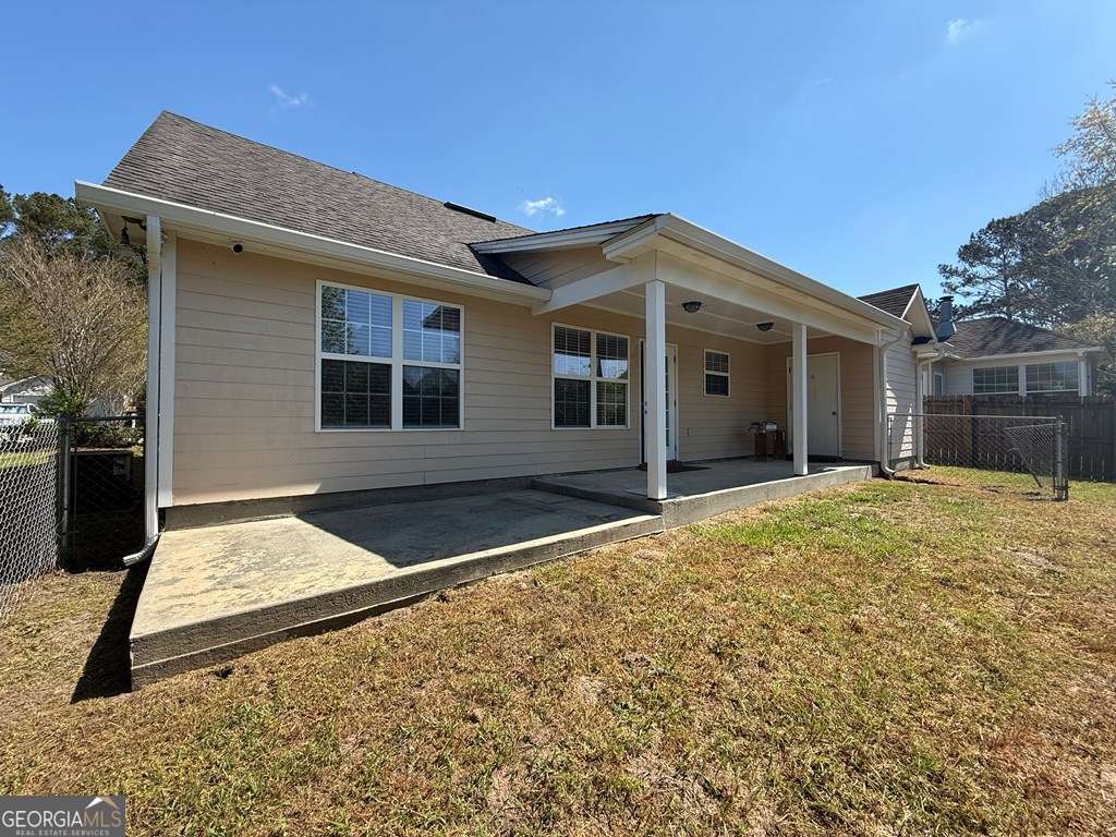4125 Springruff Drive Valdosta, GA 31602 - Photo 21 of 22 a view of a house with a yard