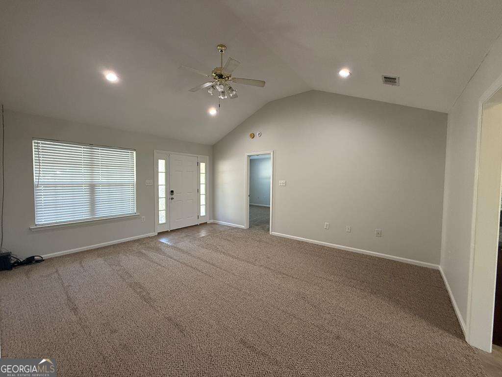 4125 Springruff Drive Valdosta, GA 31602 - Photo 4 of 22 an empty room with windows and fan
