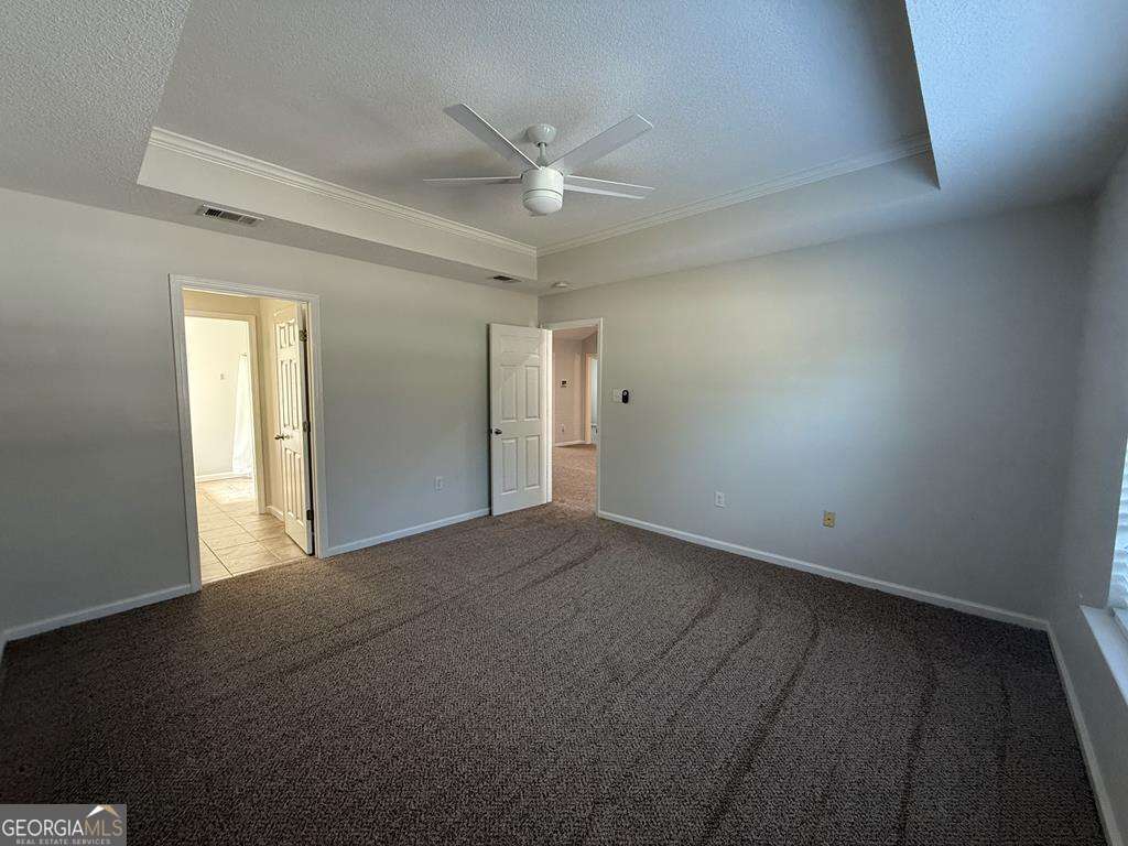 4125 Springruff Drive Valdosta, GA 31602 - Photo 10 of 22 a view of a livingroom with a ceiling fan and window