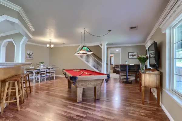 a view of a livingroom with furniture and wooden floor