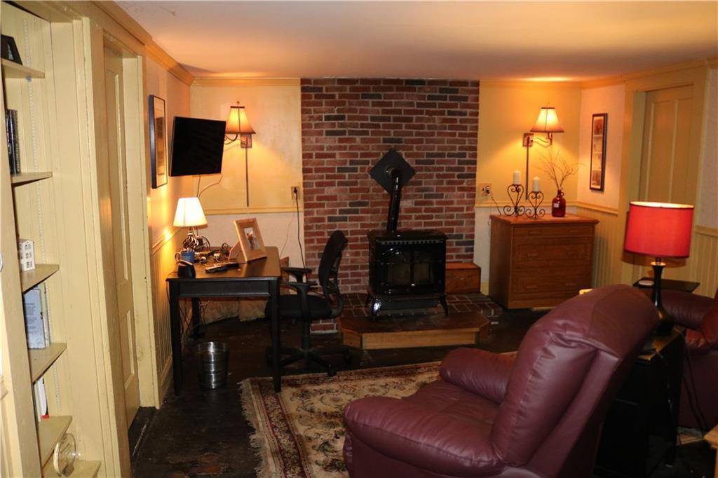 377 Main Street Springvale, ME 04083 - Photo 24 of 31 Den w/ pellet stove on brick hearth
