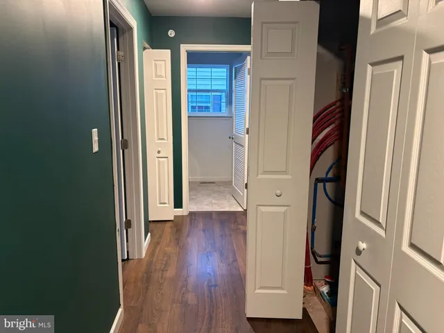 a view of an entryway with wooden floor and stairs