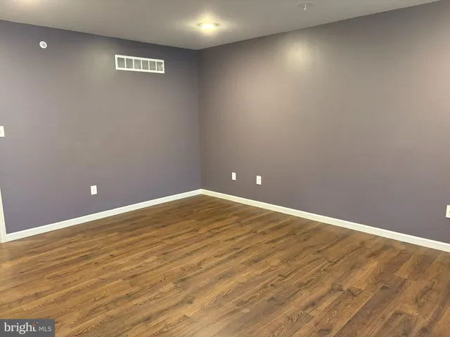 a view of walk in closet with clothes