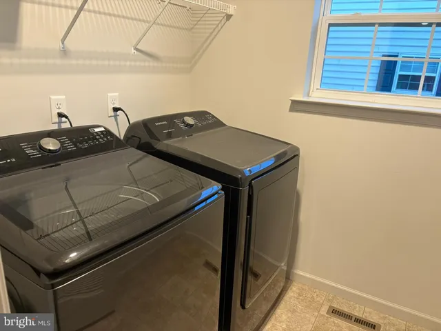 a bathroom with a toilet and a shower curtain