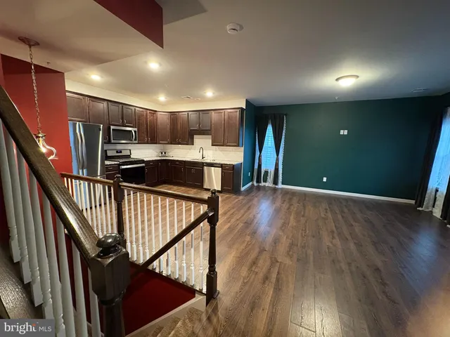 a view of kitchen and wooden floor