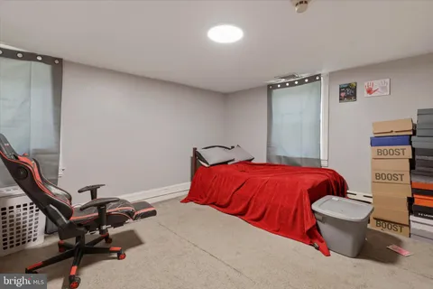 a bedroom with a bed and dresser