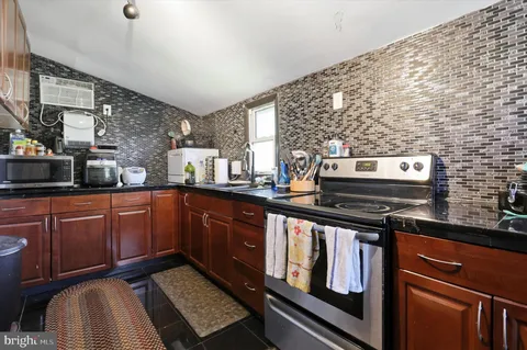 a view of a livingroom with furniture and wooden floor