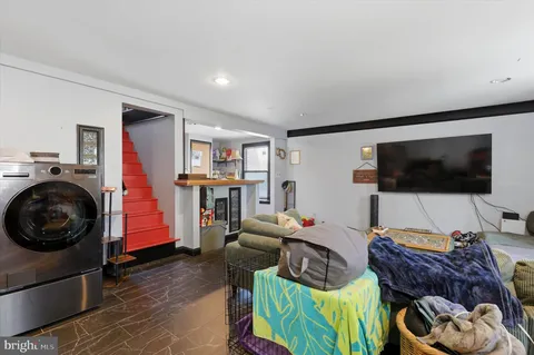 a bathroom with a tub sink and mirror