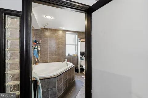 a bedroom with furniture and a bed