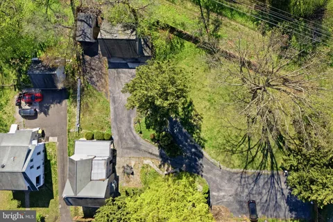 a aerial view of a house with a yard
