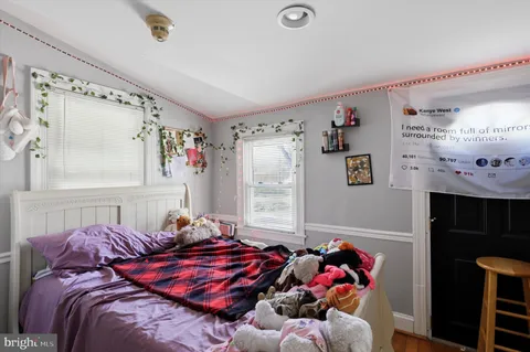 a living room with furniture and a bed