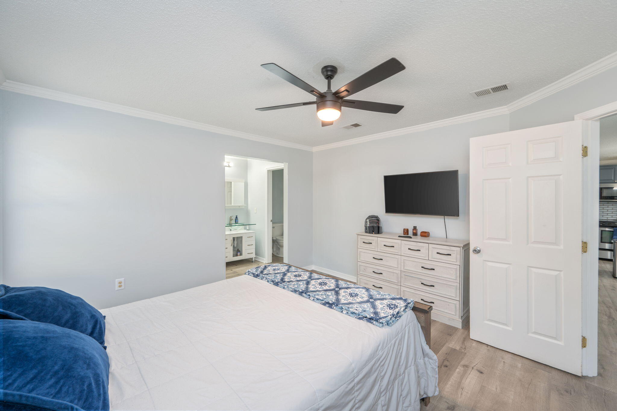 5249 Kervin Road Crestview, FL 32539 - Photo 11 of 27 a bedroom with a bed and a flat screen tv