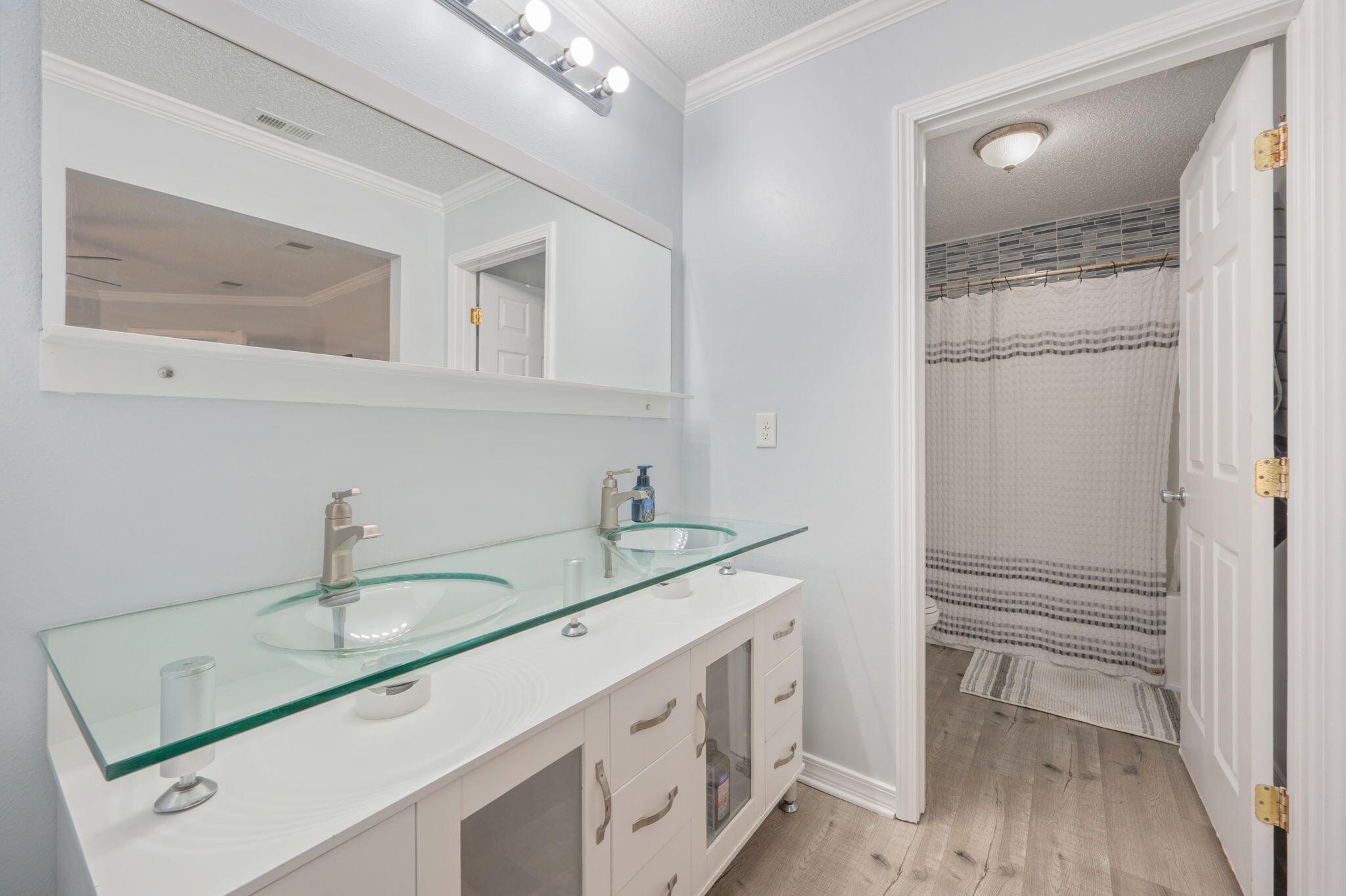 5249 Kervin Road Crestview, FL 32539 - Photo 14 of 27 a bathroom with a sink and a mirror
