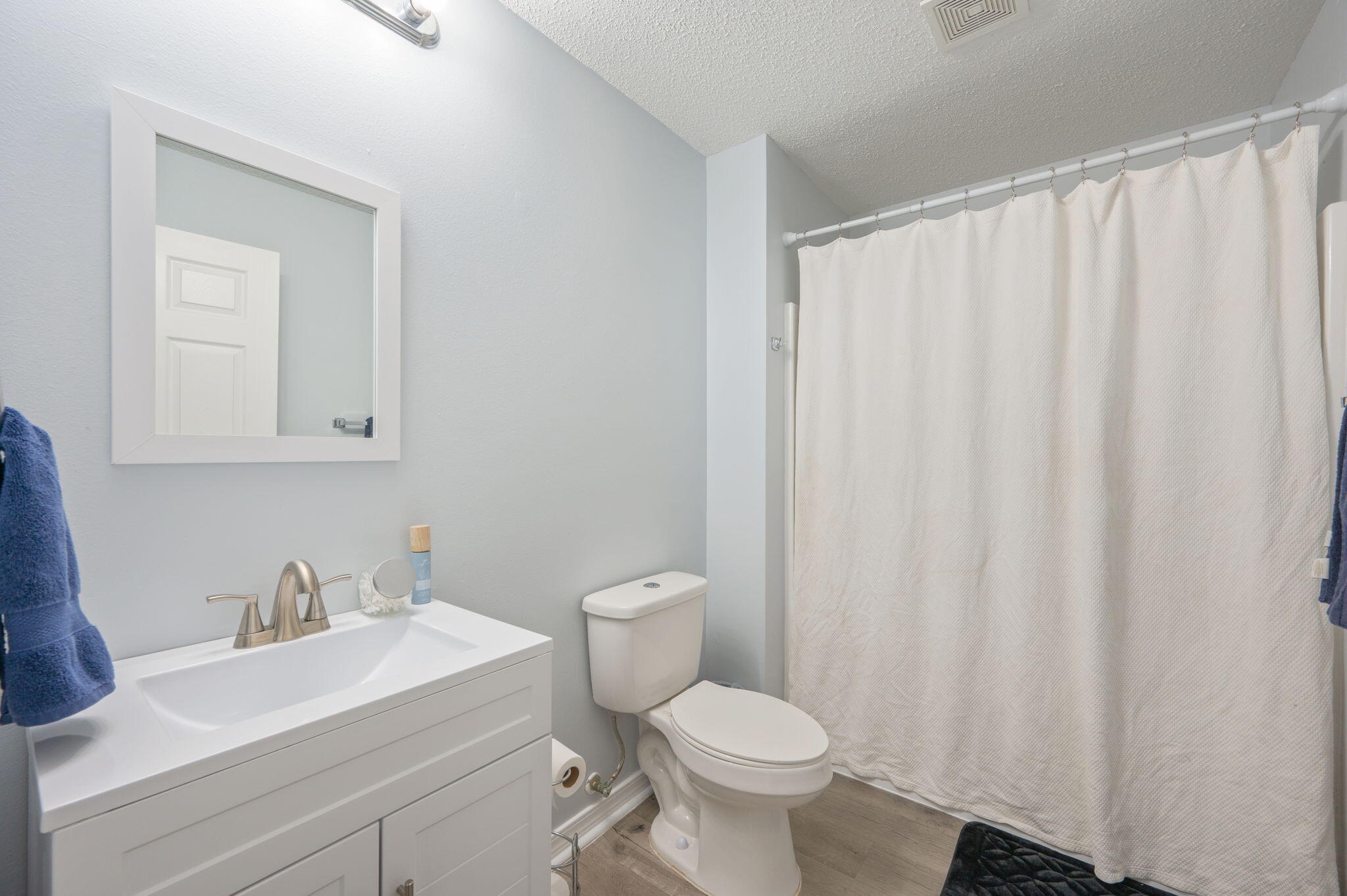 5249 Kervin Road Crestview, FL 32539 - Photo 18 of 27 a bathroom with a sink a toilet and a mirror