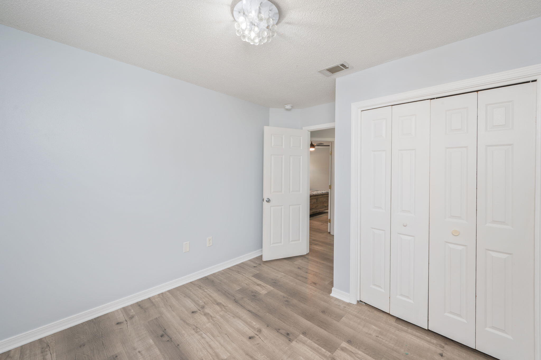 5249 Kervin Road Crestview, FL 32539 - Photo 21 of 27 wooden floor in an empty room
