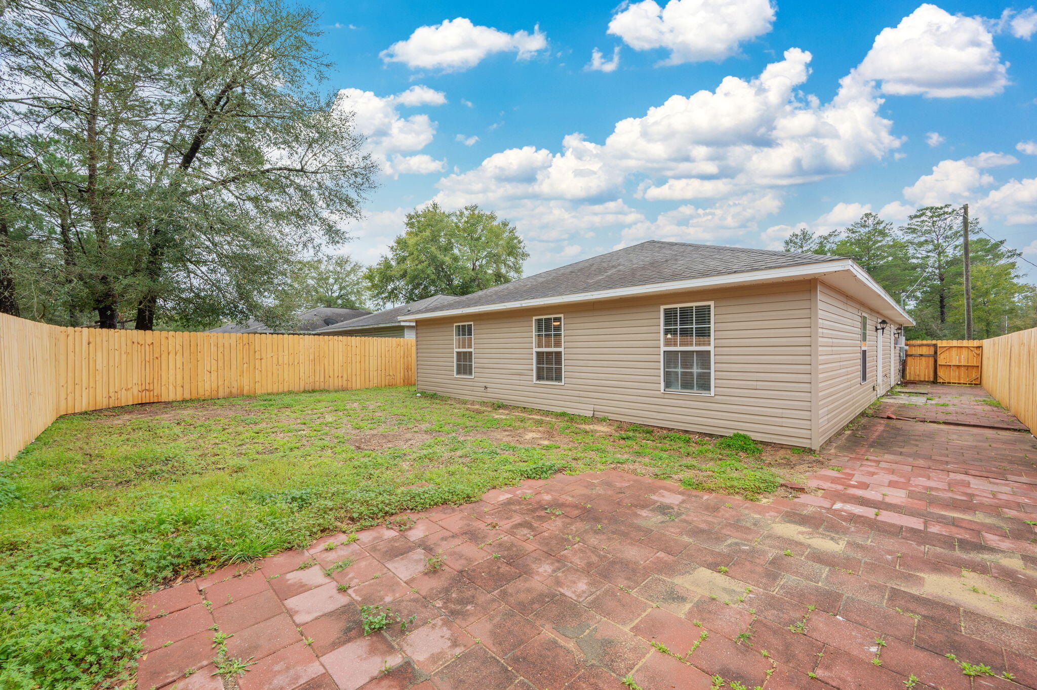 5249 Kervin Road Crestview, FL 32539 - Photo 26 of 27 a view of backyard of house with wooden fence