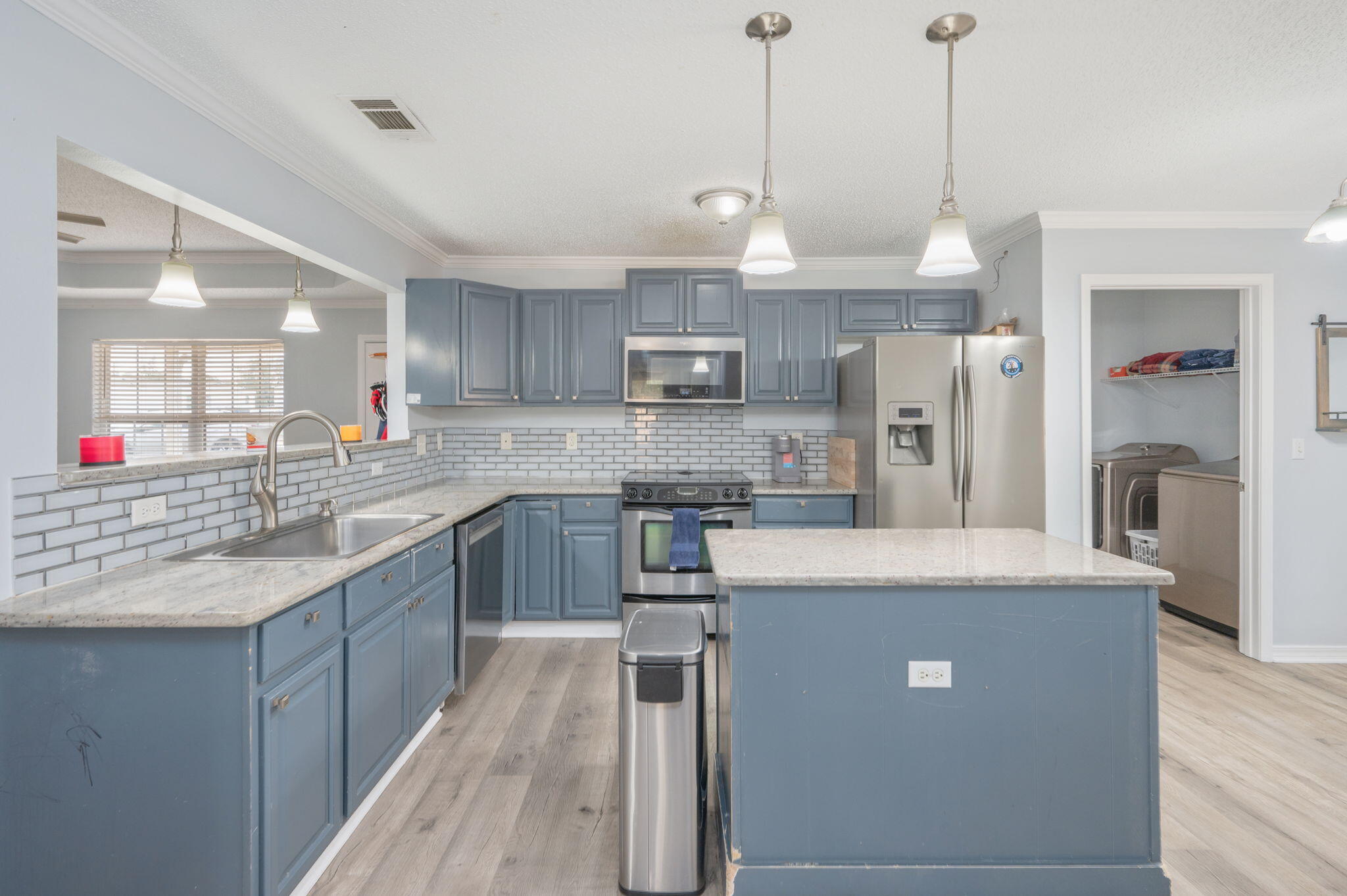 5249 Kervin Road Crestview, FL 32539 - Photo 6 of 27 a kitchen with stainless steel appliances granite countertop a sink a stove and a refrigerator