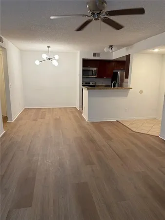 a view of a kitchen with a sink and a dishwasher