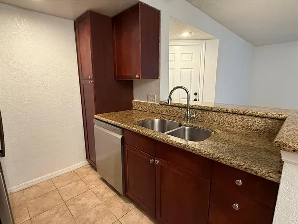 a view of a refrigerator in kitchen