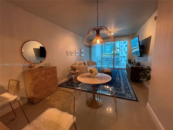a room with furniture and a flat screen tv