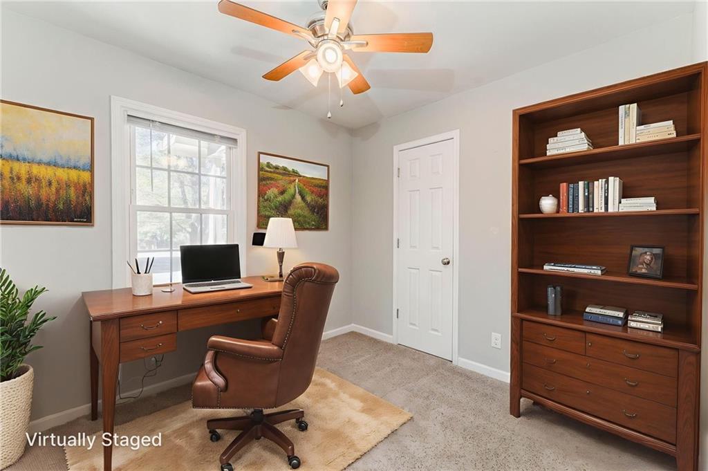 3016 Butler Creek Road Northwest Kennesaw, GA 30152 - Photo 12 of 43 a view of a workspace with furniture and a window