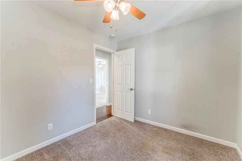 3016 Butler Creek Road Northwest Kennesaw, GA 30152 - Photo 13 of 43 an empty room with a empty space and a ceiling fan
