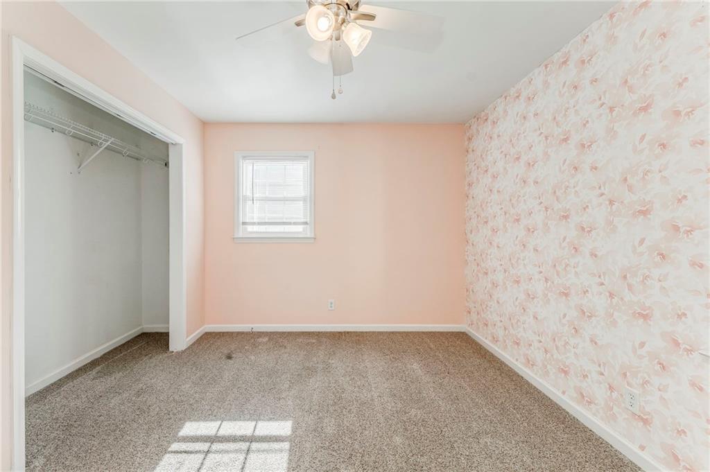 3016 Butler Creek Road Northwest Kennesaw, GA 30152 - Photo 14 of 43 an empty room with a window
