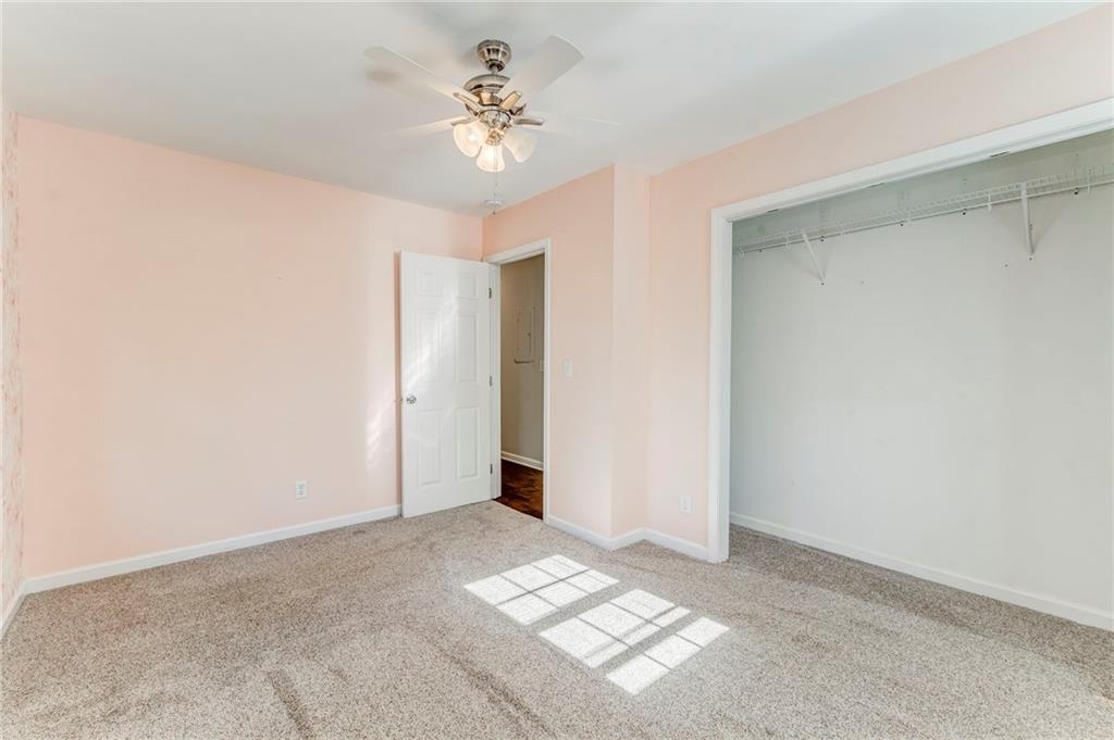 3016 Butler Creek Road Northwest Kennesaw, GA 30152 - Photo 16 of 43 a view of a big room with windows and chandelier fan