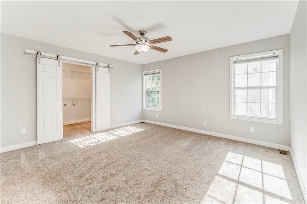 3016 Butler Creek Road Northwest Kennesaw, GA 30152 - Photo 17 of 43 a view of an empty room with a window