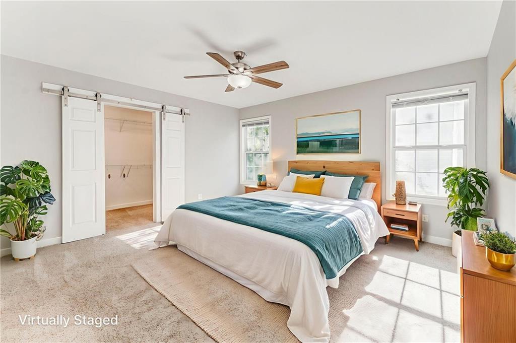 3016 Butler Creek Road Northwest Kennesaw, GA 30152 - Photo 18 of 43 a bedroom with a large bed and a potted plant
