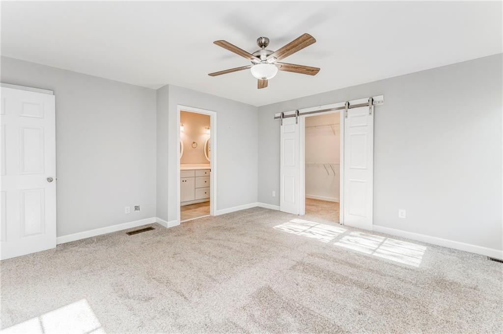 3016 Butler Creek Road Northwest Kennesaw, GA 30152 - Photo 19 of 43 an empty room with closet and windows