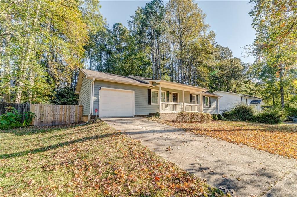 3016 Butler Creek Road Northwest Kennesaw, GA 30152 - Photo 2 of 43 a front view of a house with a yard
