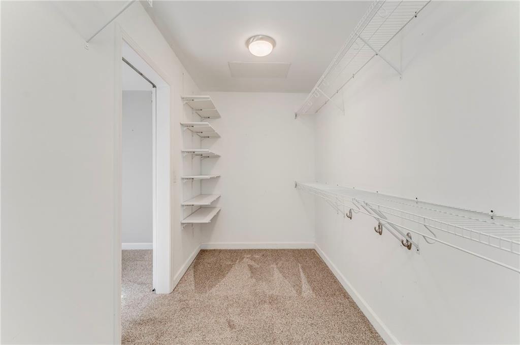 3016 Butler Creek Road Northwest Kennesaw, GA 30152 - Photo 21 of 43 a view of walk in closet with empty racks