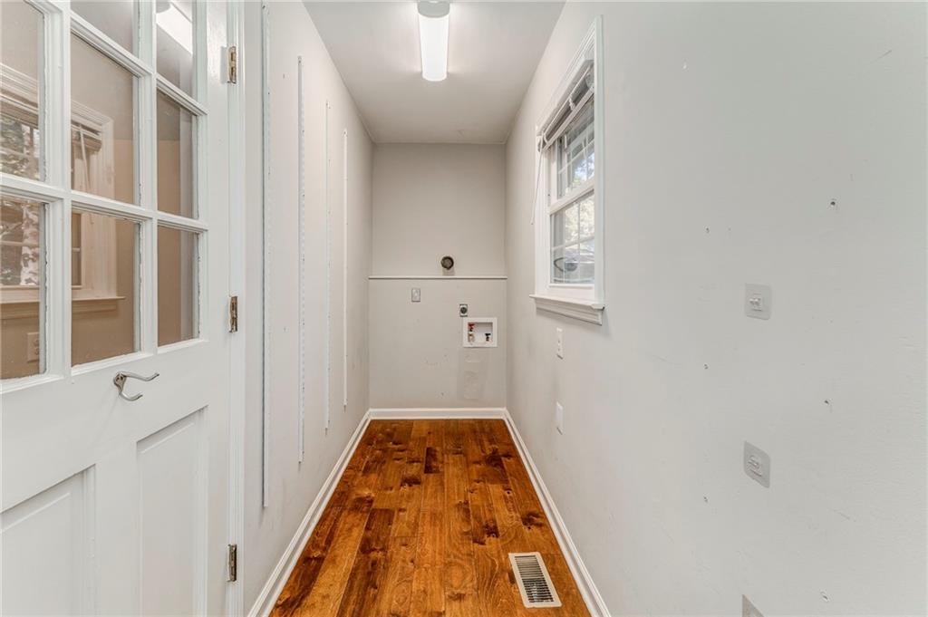 3016 Butler Creek Road Northwest Kennesaw, GA 30152 - Photo 28 of 43 a view of a hallway with wooden floor and entryway