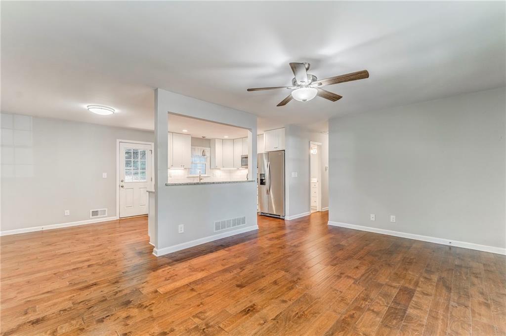 3016 Butler Creek Road Northwest Kennesaw, GA 30152 - Photo 39 of 43 a view of an empty room with a kitchen