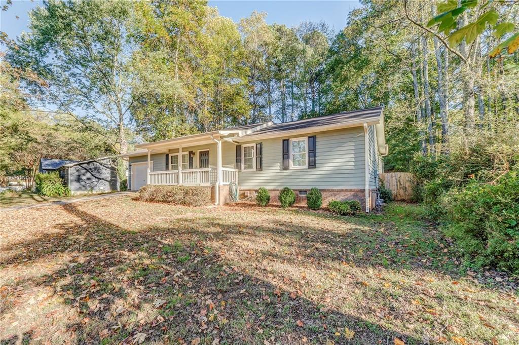 3016 Butler Creek Road Northwest Kennesaw, GA 30152 - Photo 4 of 43 front view of a house with a yard