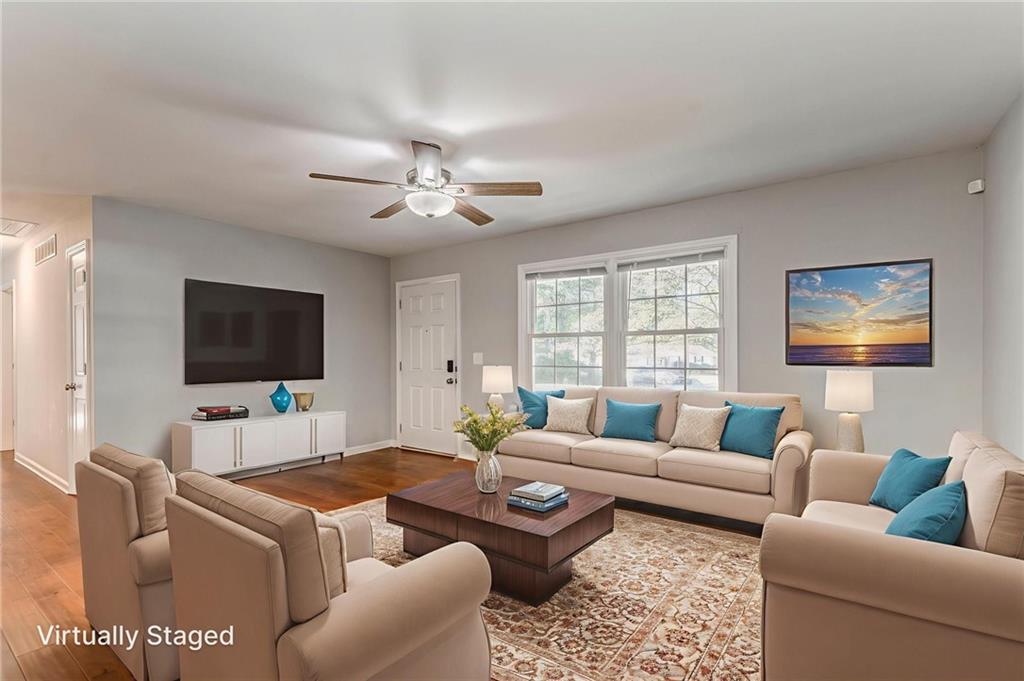 3016 Butler Creek Road Northwest Kennesaw, GA 30152 - Photo 41 of 43 a living room with furniture and a flat screen tv