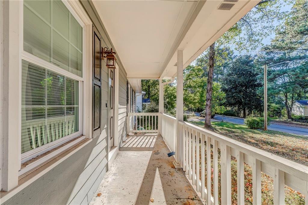 3016 Butler Creek Road Northwest Kennesaw, GA 30152 - Photo 5 of 43 a view of a house with a small deck