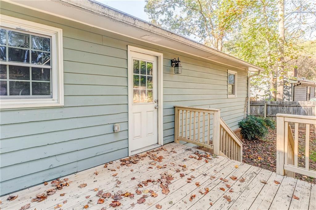 3016 Butler Creek Road Northwest Kennesaw, GA 30152 - Photo 8 of 43 a front view of a house with a yard