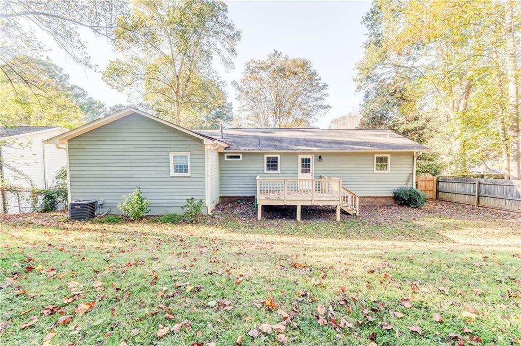 3016 Butler Creek Road Northwest Kennesaw, GA 30152 - Photo 10 of 43 a view of a house with a chairs in a patio